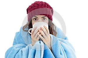 Woman feeling cold and drinking warm tea photo