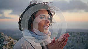 Woman feeling cold rocky terrain at evening serenity closeup. Portrait traveler