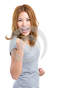 Woman feeling excited with arm fist posture