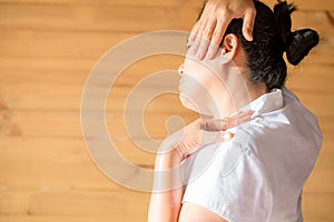 Woman feeling exhausted and suffering from neck pain
