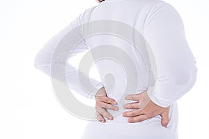 A woman feeling exhausted and suffering from waist and back pain and injury on isolated white background. Health care and medical