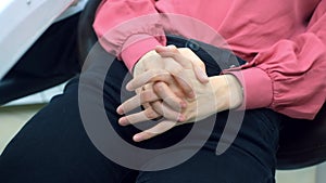 Woman feeling nervous and rubbing hands in troubles, problems, stress.