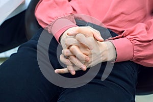 Woman feeling nervous and rubbing hands in troubles, problems, stress.