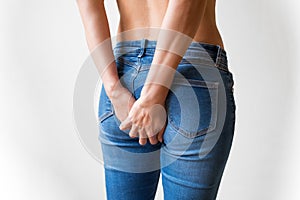 Woman feeling pain in buttocks area