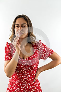 woman feeling pain and holding hand cheek suffering from severe toothache isolated on white.