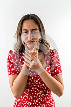 woman feeling pain and holding hand cheek suffering from severe toothache isolated on white.