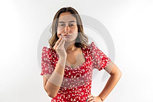 woman feeling pain and holding hand cheek suffering from severe toothache  on white.