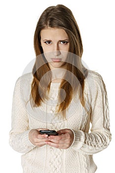 Woman is feeling sad while reading sms