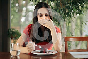 Woman Feeling Sick From Eating Chocolate Cake