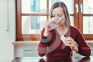 Woman feeling sick or unwell and taking medication