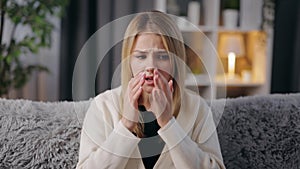 Woman feeling sore throat home
