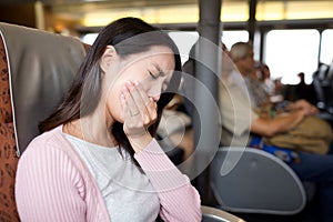 Woman feeling unwell on boat