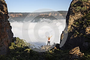 Woman feelings of exhilaration hiking in Blue Mountains Australia