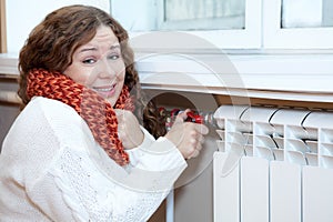 Woman feels cold when turning thermostat of central heating con