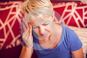 Woman feels strong headache. People, healthcare and medicine concept