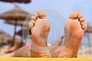 Woman feet on the beach