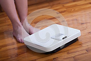 Woman feet and body weight scale