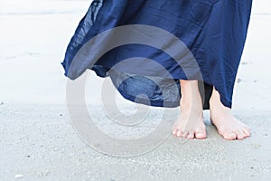 Woman feet closeup of girl relaxing on beach