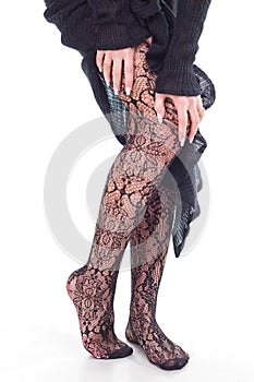 Woman feet with fishnet tights
