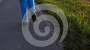 Woman feet running in the park.