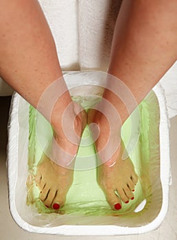 Woman feet in spa bowl