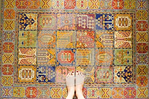 Woman Feet Standing on Vintage Carpet