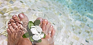 Woman feet in water