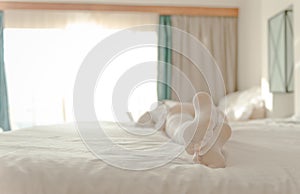 Woman feet in white stockings