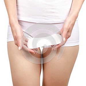 Woman female body hygienic napkin menstruation in hand