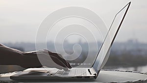 Woman female hands typing on laptop computer keyboard. Businesswoman typing on office laptop. Technology and business concept