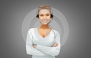 woman or female helpline operator in headset