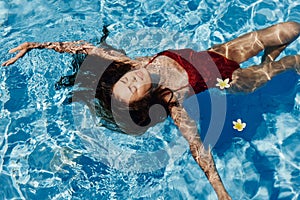 Woman female vacations body lifestyle water blue pool person wet summer beauty swim girl