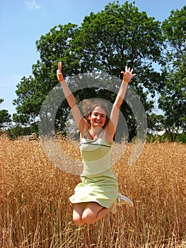 Woman in field jump