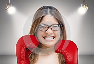 Woman fighting with red boxing gloves