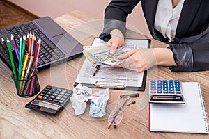 Woman filling 1040 individual income tax return