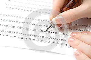 Woman filling the exam test sheet
