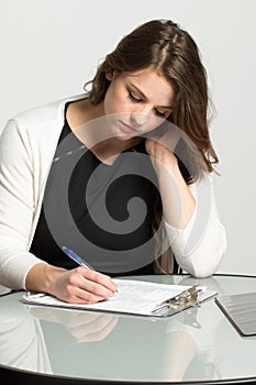 Woman filling out a job application.