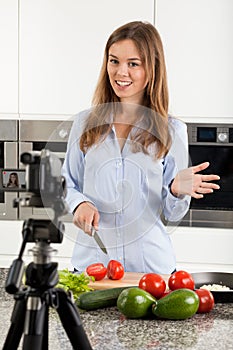 Woman filming her meal preparation