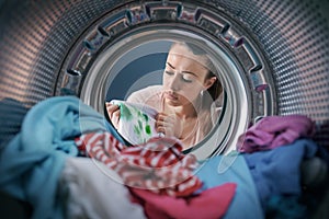 Woman finds stained clothes in the washing machine photo