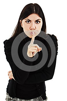 Woman with finger at mouth showing silence sign