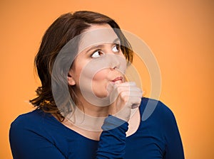Woman with finger in mouth, sucking thumb