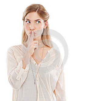 Woman, finger to lips for secret and gossip in studio, private and confidential information on white background. News