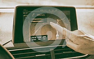 Woman finger using navigation system while driving a car