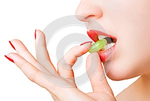 Woman fingers holding a candy