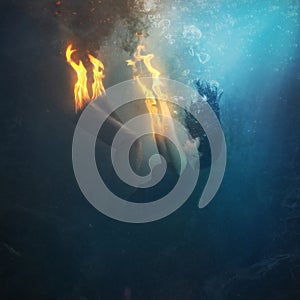Woman on fire underwater