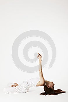 Woman in fish Yoga posture (Matsyasana)