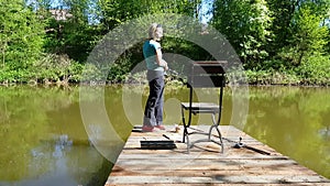 Woman fishing on pond