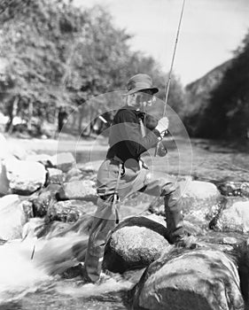 Woman fishing in river