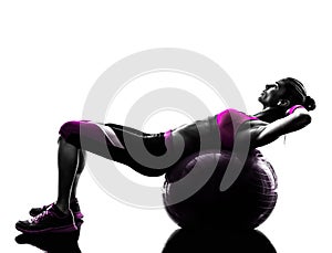 Woman fitness ball crunches exercises silhouette