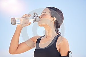 Woman, fitness and drinking water for natural nutrition or sustainability after workout, running or outdoor exercise